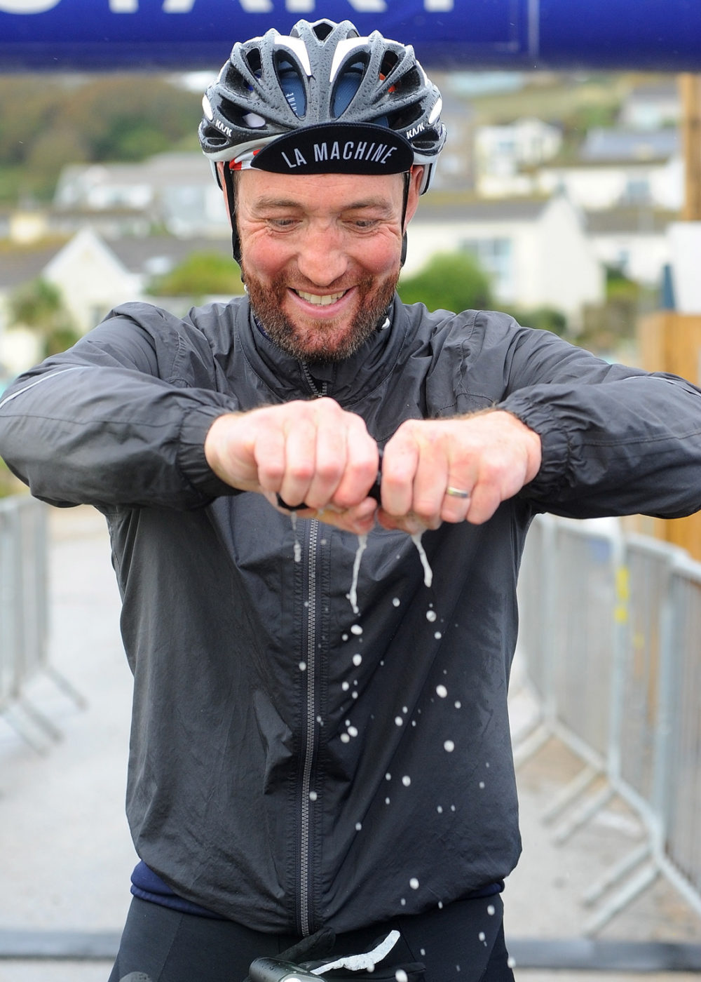 cyclist wringing hat lands end 100 sportiva events the modest photographer ali macphee
